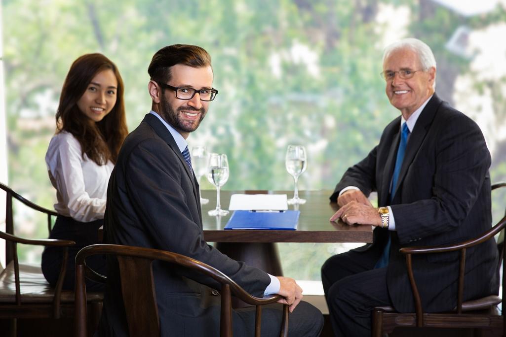 Three Business People Posing to Camera